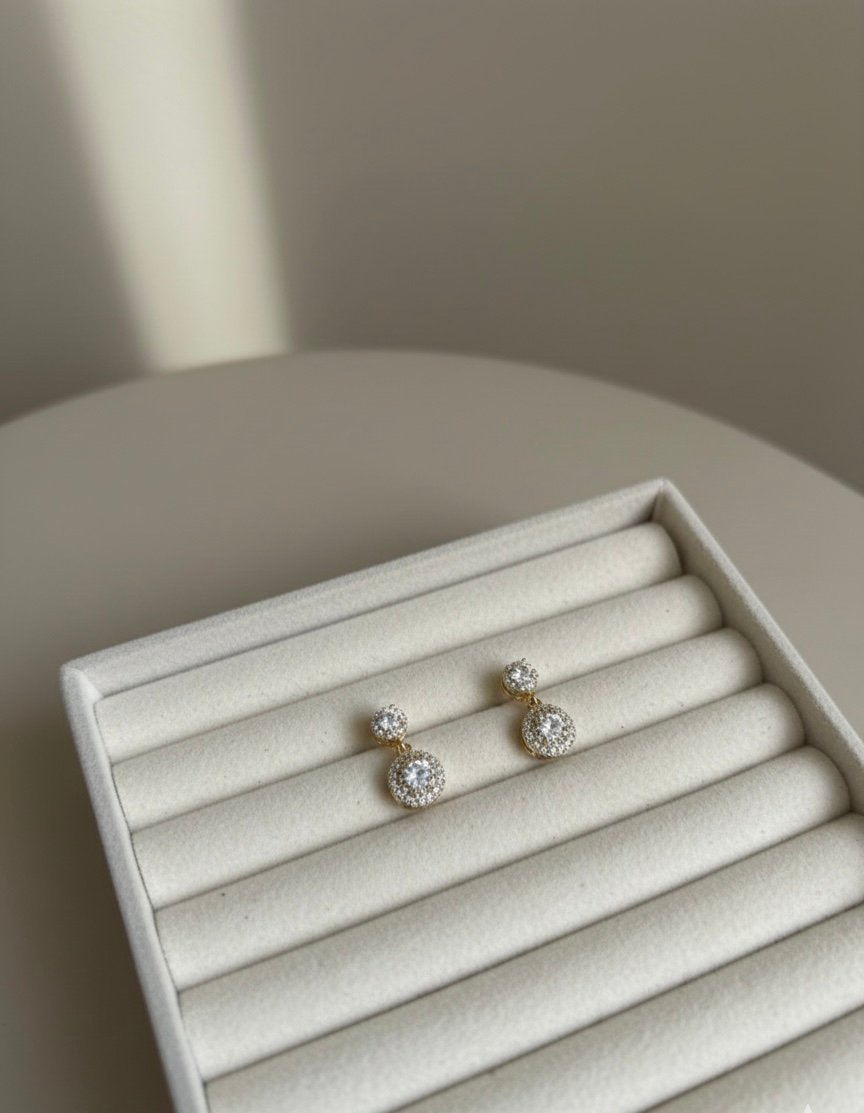 Brinco pendulo redondo com pedra